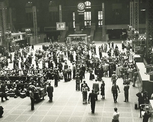 Crowd of people on Penn Station, New York City, (B&W), elevated view