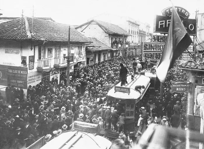 Framed Print : Crowds Cheer Victory in Street