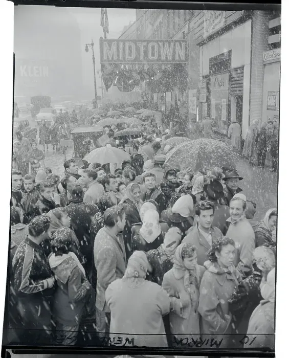 Framed Print : Crowds Waiting in Snow for Sale Items