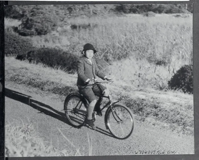 Framed Print : Crown Prince Akihito Riding Bicycle on Palace Grounds