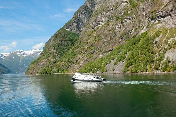 Cruise ship navigate in Geirangerfjord
