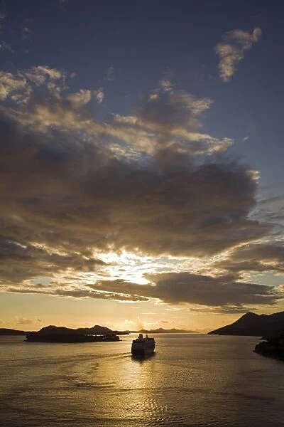 Cruise ship sailing into a sunset, Port of Dubrovnik, Croatia