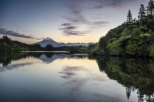 Currently inactive volcano, Mt. Egmont, Mt. Taranaki, reflection in the reservoir of Lake Mangamahoe, North Island, New Zealand
