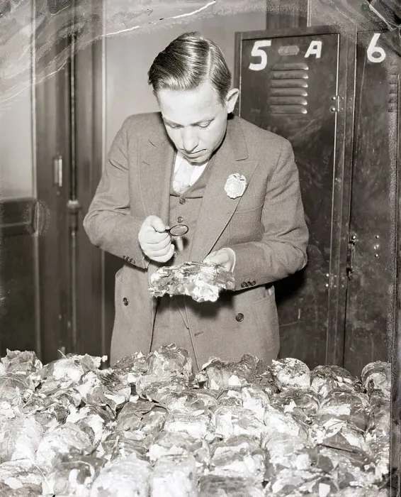 Framed Print : Customs Inspector Examines Opium Package