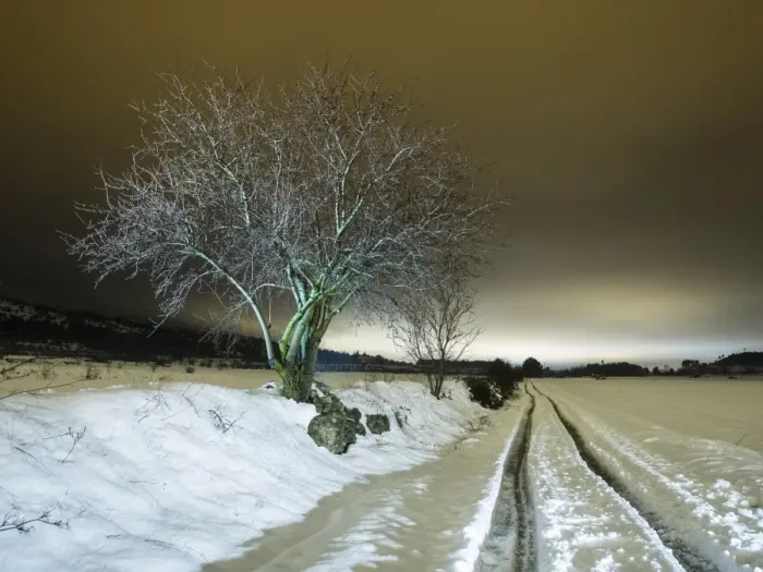 Framed Print : Cut road covered of snow close to a few fields in the night Framed Print : Cut road covered of snow close to a few fields in the night