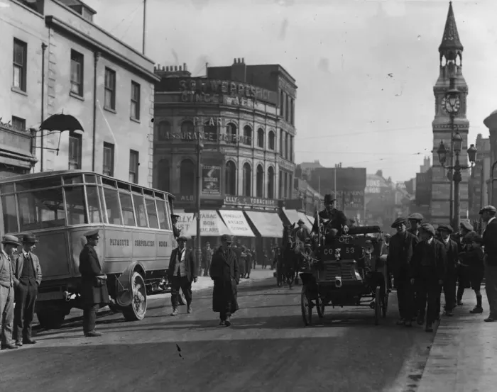Framed Print : Cycle Car. circa 1921: A street scene: the car on the right is a cycle car Framed Print : Cycle Car. circa 1921: A street scene: the car on the right is a cycle car