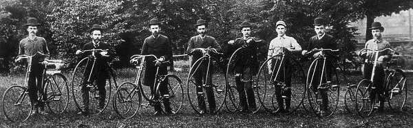Cycle Club. A group of men in derby hats pose with a variety of cycles, circa 1900