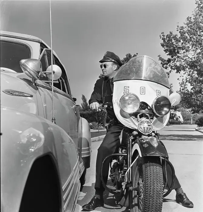 Framed Print : Cycle Cop. A motorcycle policeman talking to a man Framed Print : Cycle Cop. A motorcycle policeman talking to a man