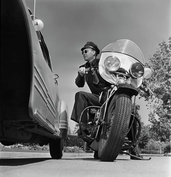 Framed Print : Cycle Cop. A motorcycle policeman talking to a man Framed Print : Cycle Cop. A motorcycle policeman talking to a man