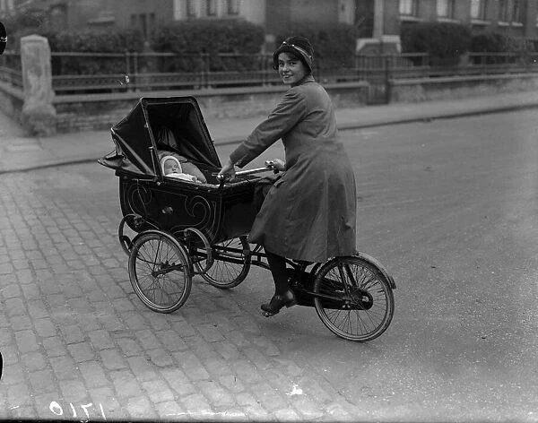 Cyclepram. 1926: A mother gets all the exercise she needs pushing her pram