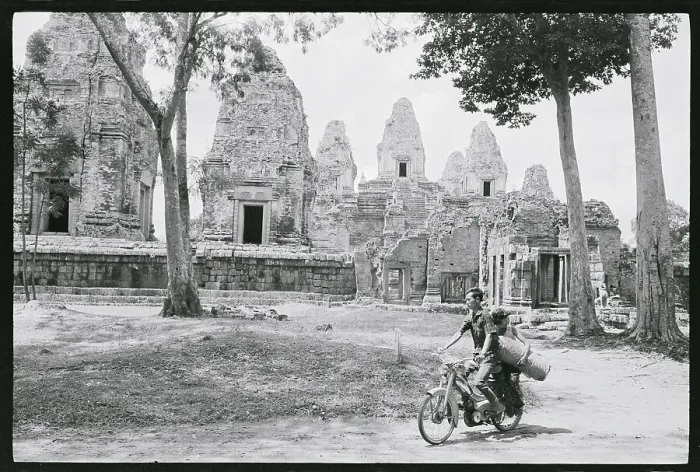 Framed Print : Cyclists Pictured Riding Through the Bayon Framed Print : Cyclists Pictured Riding Through the Bayon