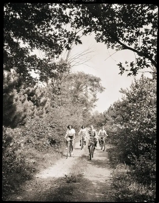 Framed Print : Cyclists Ride Down a Country Road Framed Print : Cyclists Ride Down a Country Road