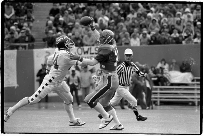Framed Print : Dan Marino has Football, Gets Rushed by Temple Player Framed Print : Dan Marino has Football, Gets Rushed by Temple Player