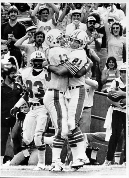 Framed Print : Dan Marino Hugs Teammate Jimmy Cefalo