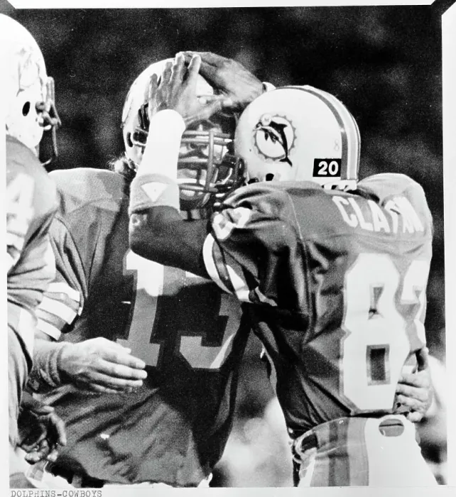 Framed Print : Dan Marino and Mark Clayton Butt Helmets in Celebration Framed Print : Dan Marino and Mark Clayton Butt Helmets in Celebration