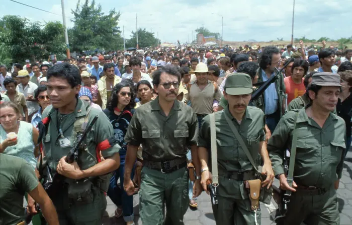 Framed Print : Daniel Ortega Marching with Demonstrators