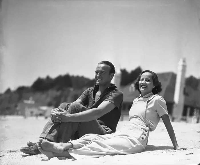 Framed Print : David Niven and Merle Oberon Relaxing at the Beach Framed Print : David Niven and Merle Oberon Relaxing at the Beach