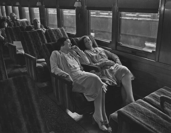 Day Coach. Passengers relaxing on board a Baltimore