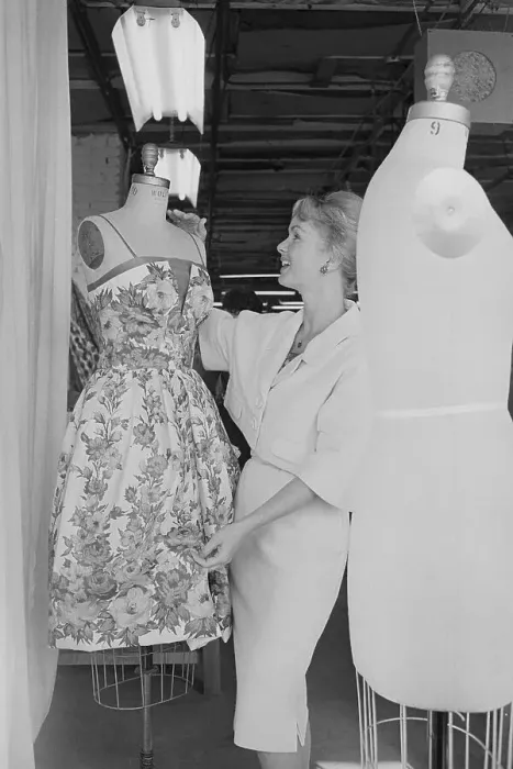 Framed Print : Debbie Reynolds Examining Dress Framed Print : Debbie Reynolds Examining Dress