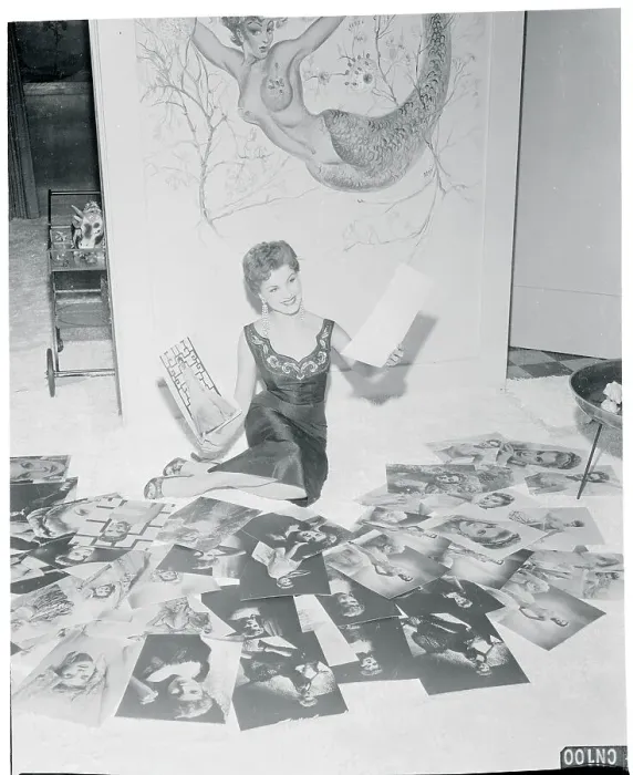 Framed Print : Debra Paget Reviewing a Batch of Photographs Framed Print : Debra Paget Reviewing a Batch of Photographs