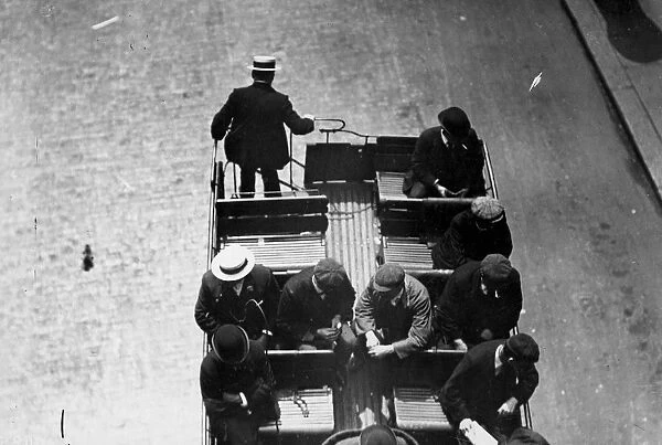 Top Deck. July 1907: Passengers on the top deck of an omnibus, one leaving by the stairs