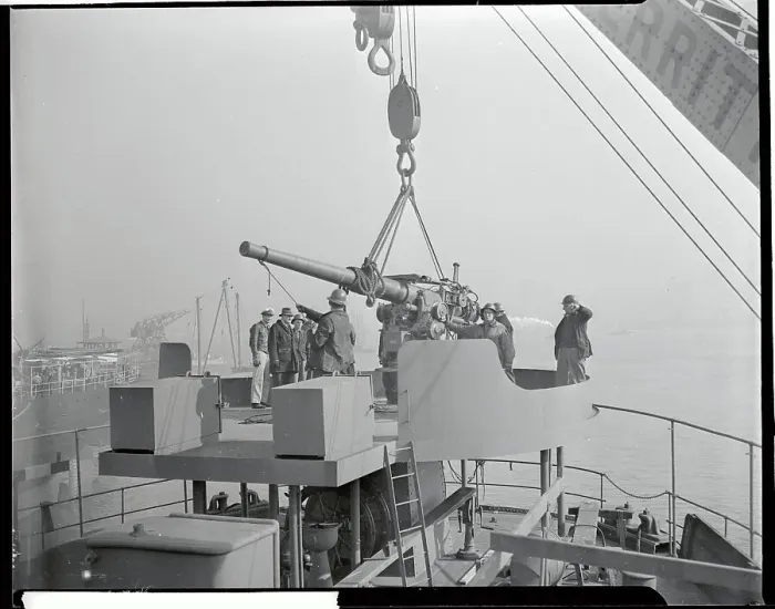 Framed Print : Deck Gun Being Placed on Ship Framed Print : Deck Gun Being Placed on Ship
