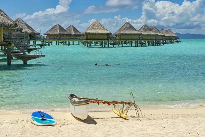 Framed Print : Decorated outrigger boat in front of overwater bungalows, Bora Bora, French Polynesia Framed Print : Decorated outrigger boat in front of overwater bungalows, Bora Bora, French Polynesia