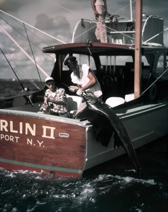 Framed Print : Deep Sea Fishing Boat Man At Helm Two Men On Stern One Hold Rod Reel One Pulls Fish Framed Print : Deep Sea Fishing Boat Man At Helm Two Men On Stern One Hold Rod Reel One Pulls Fish