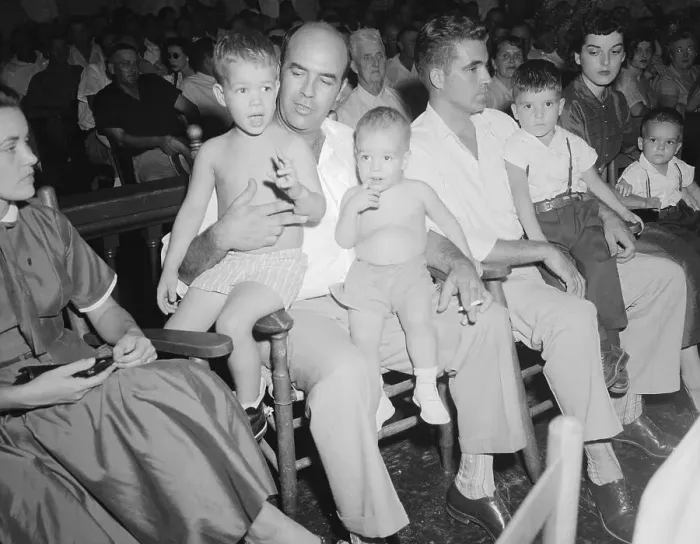 Framed Print : Defendants Holding Their Children During a Trial