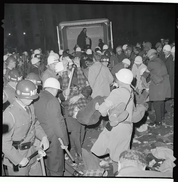 Framed Print : Demonstrator Being Carried to Van Framed Print : Demonstrator Being Carried to Van