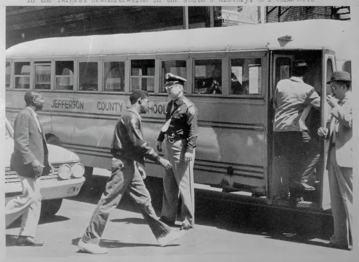 Framed Print : Demonstrators Getting on School Bus