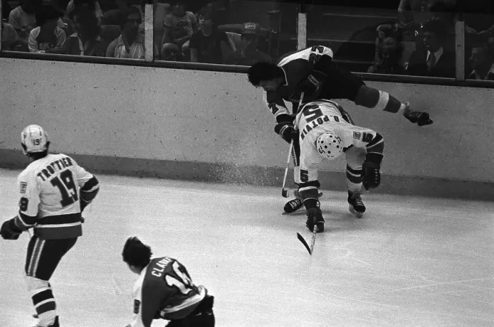 Framed Print : Denis Potvin Knocking Reggie Leach Off His Feet
