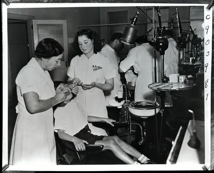 Framed Print : Dental Workers Work on Patients Framed Print : Dental Workers Work on Patients