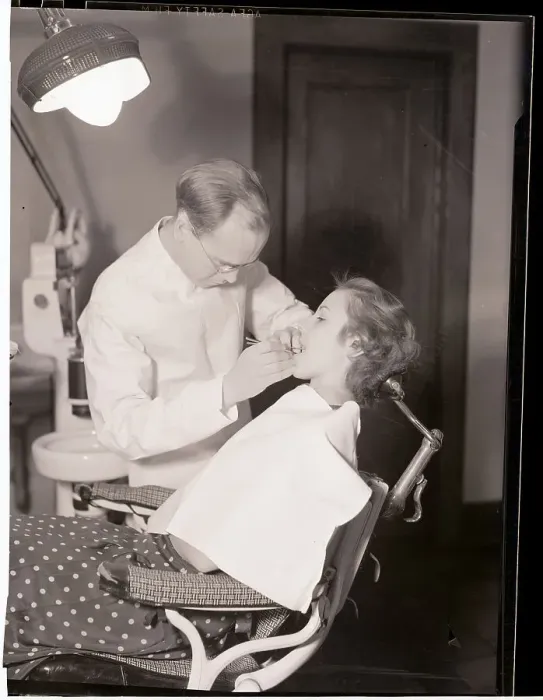 Framed Print : Dentist Examining Patients Teeth Framed Print : Dentist Examining Patients Teeth