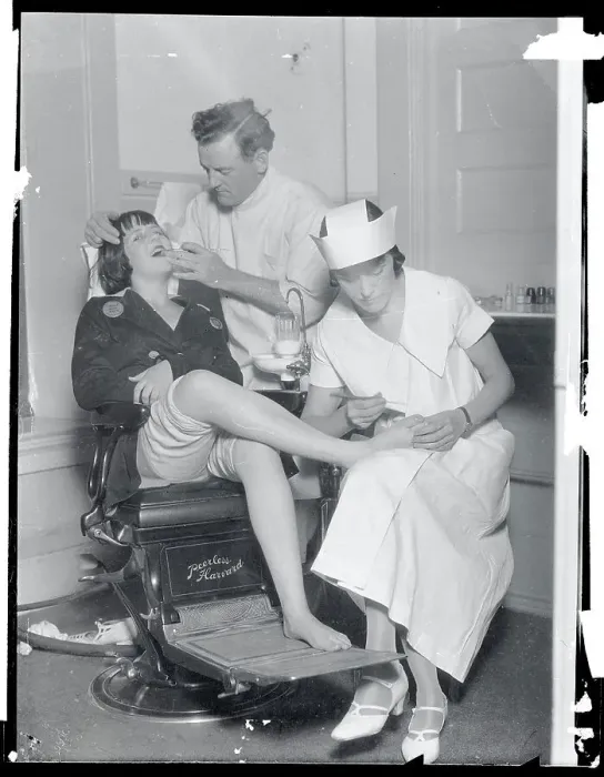 Framed Print : Dentist and Nurse Working on Teeth and Feet Framed Print : Dentist and Nurse Working on Teeth and Feet