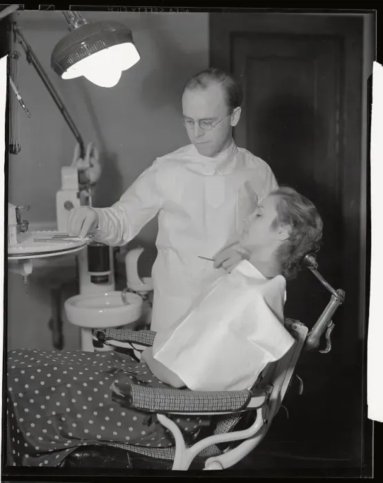 Framed Print : Dentist Preparing to Treat Female Patient Framed Print : Dentist Preparing to Treat Female Patient