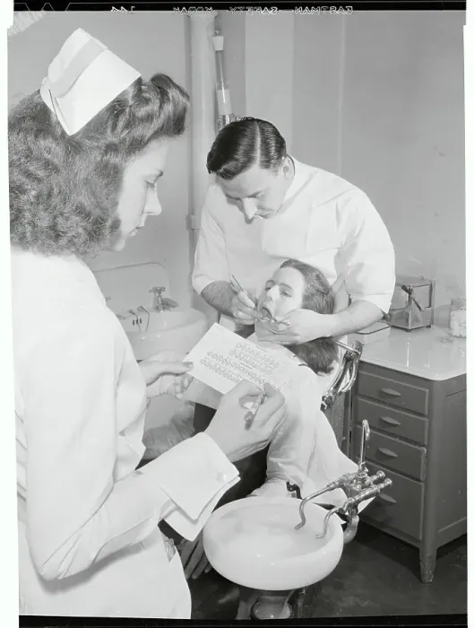 Framed Print : Dentists Performing a Dental Examination Framed Print : Dentists Performing a Dental Examination