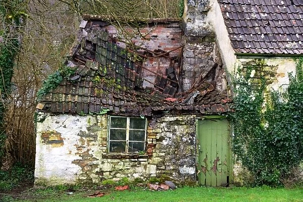 Derelict house with collapsing roof