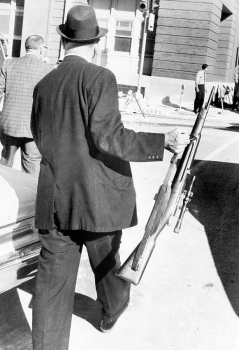 Framed Print : Detective Carries President Kennedy Murder Weapon Framed Print : Detective Carries President Kennedy Murder Weapon