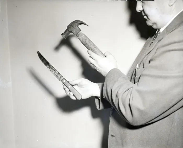 Framed Print : Detective Holding Hammer And Knife Framed Print : Detective Holding Hammer And Knife