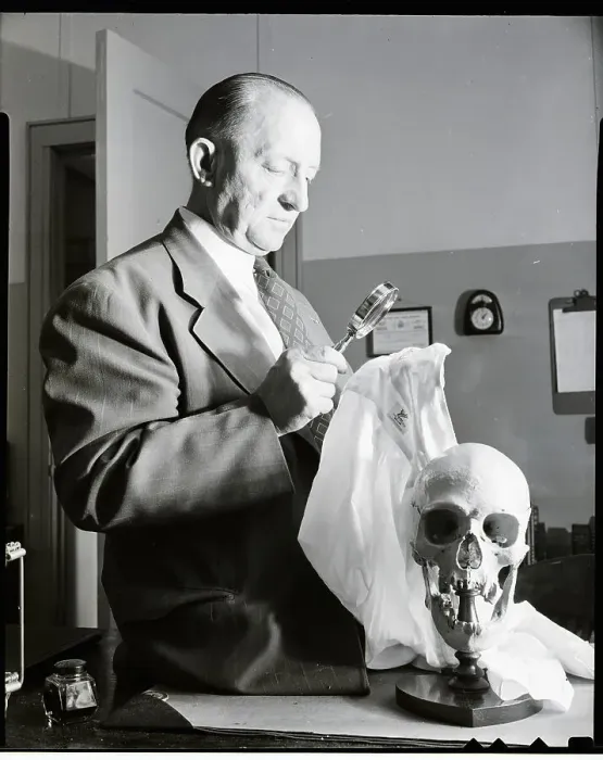 Framed Print : Detective Standing Next to Mounted Skull Framed Print : Detective Standing Next to Mounted Skull