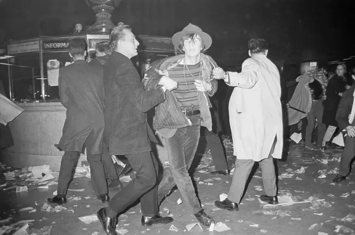 Framed Print : Detectives Drag Away Oddly-Dressed Man Framed Print : Detectives Drag Away Oddly-Dressed Man