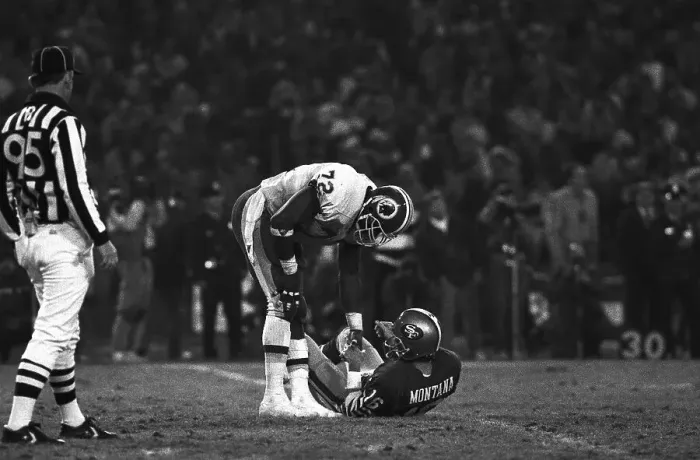 Framed Print : Dexter Manley Helps Joe Montana up Framed Print : Dexter Manley Helps Joe Montana up