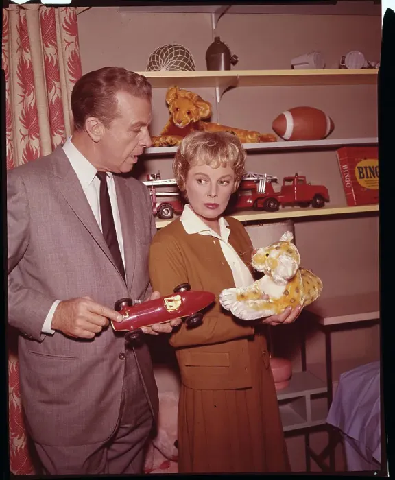Framed Print : Dick Powell and June Allyson Holding Children's Toys Framed Print : Dick Powell and June Allyson Holding Children's Toys