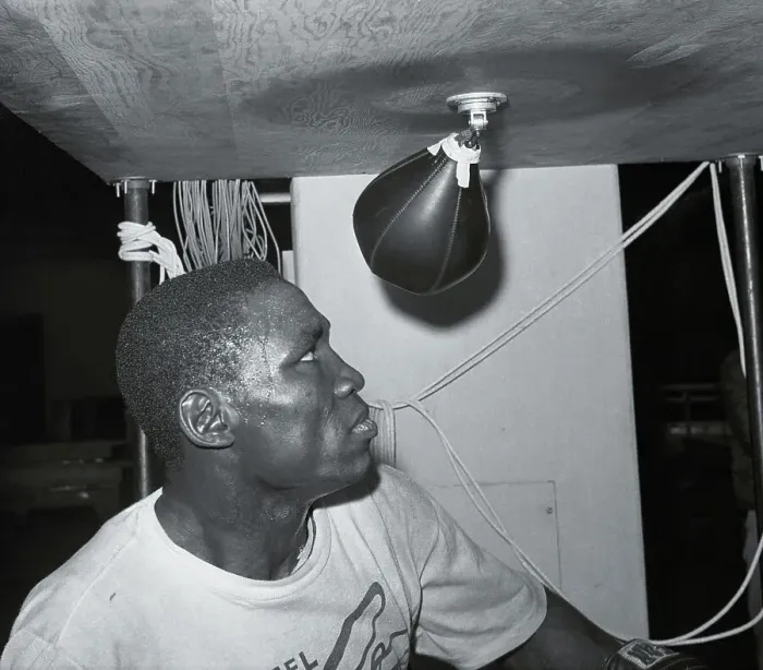 Framed Print : Dick Tiger Practicing on Punching Equipment