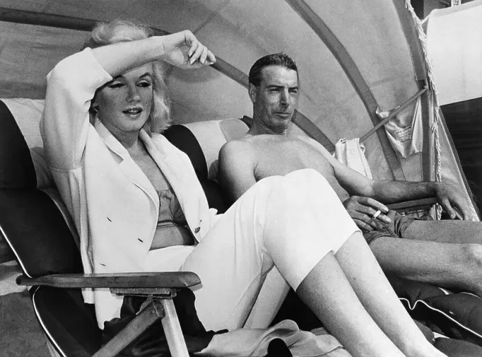Framed Print : DiMaggio and Monroe Lounging on Beach in Florida Framed Print : DiMaggio and Monroe Lounging on Beach in Florida