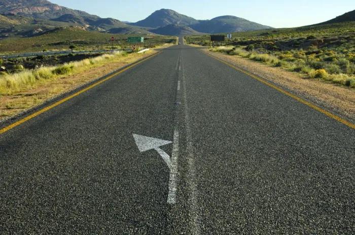 Framed Print : Directional arrow to the left on the straight strip of asphalt at the National Road N7 near Springbok on the road north to the border with Namibia, Northern Cape Province, South Africa, Africa Framed Print : Directional arrow to the left on the straight strip of asphalt at the National Road N7 near Springbok on the road north to the border with Namibia, Northern Cape Province, South Africa, Africa