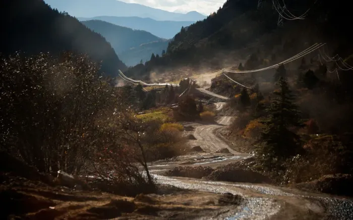 Framed Print : Dirt road through valley Framed Print : Dirt road through valley