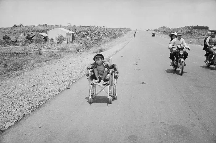 Framed Print : Disabled Boy Traveling Along Highway Framed Print : Disabled Boy Traveling Along Highway