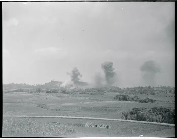 Framed Print : Distant View of Smoking Land Areas Under Bomb Attack